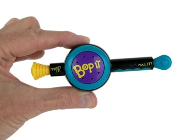 Picture of WORLDS SMALLEST 5052 World's Smallest Bop It! The Classic Game of Bop It, Twist It, Pull It in Miniature Size. Travel Electronic Game. Play Solo or with Multiple Players (EA)